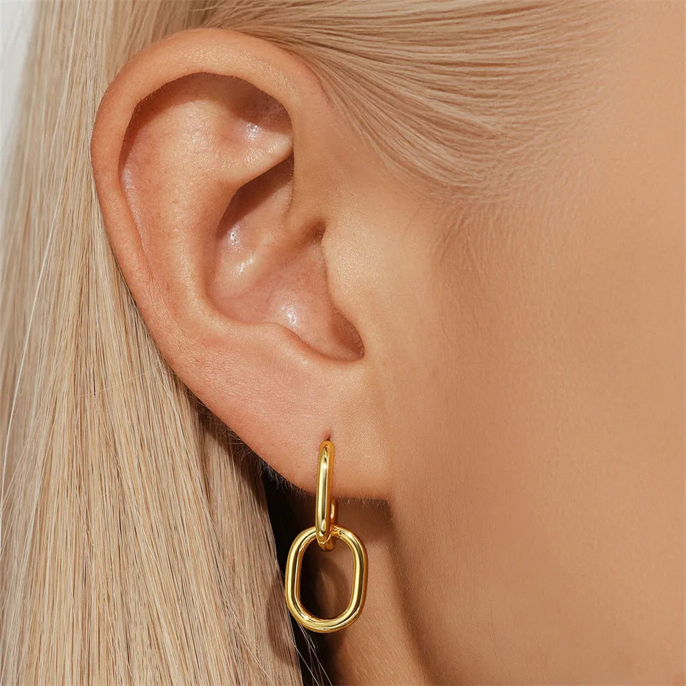 Gold tone brass diamond earclip earrings with geometric round shape and European styling