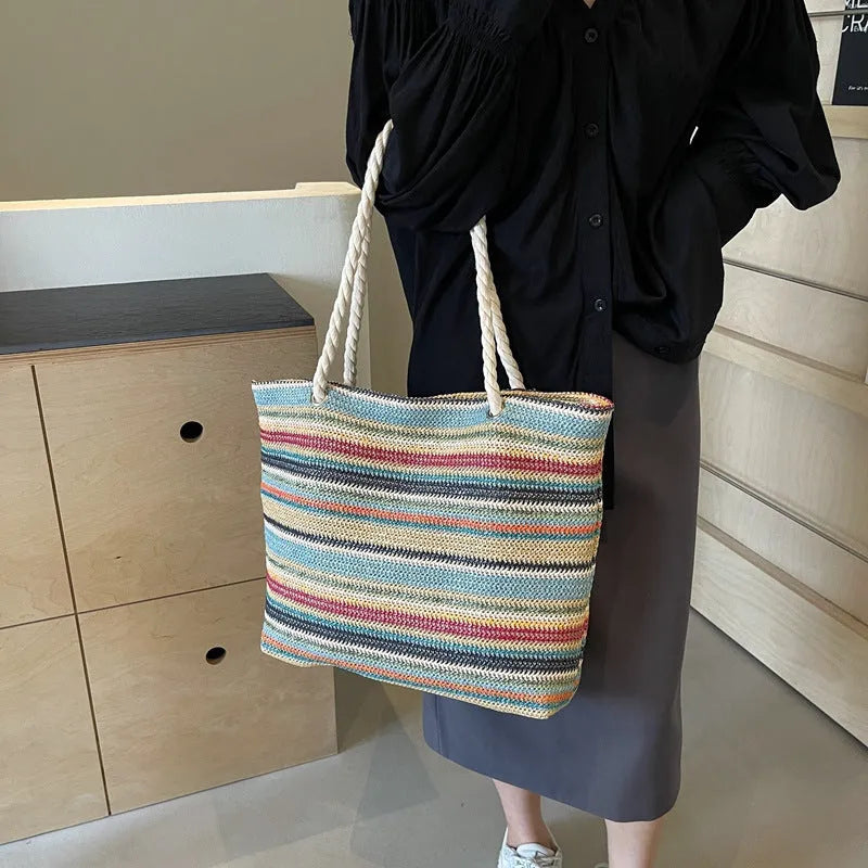Blue straw and nylon woven large shoulder bag with polyester lining.
