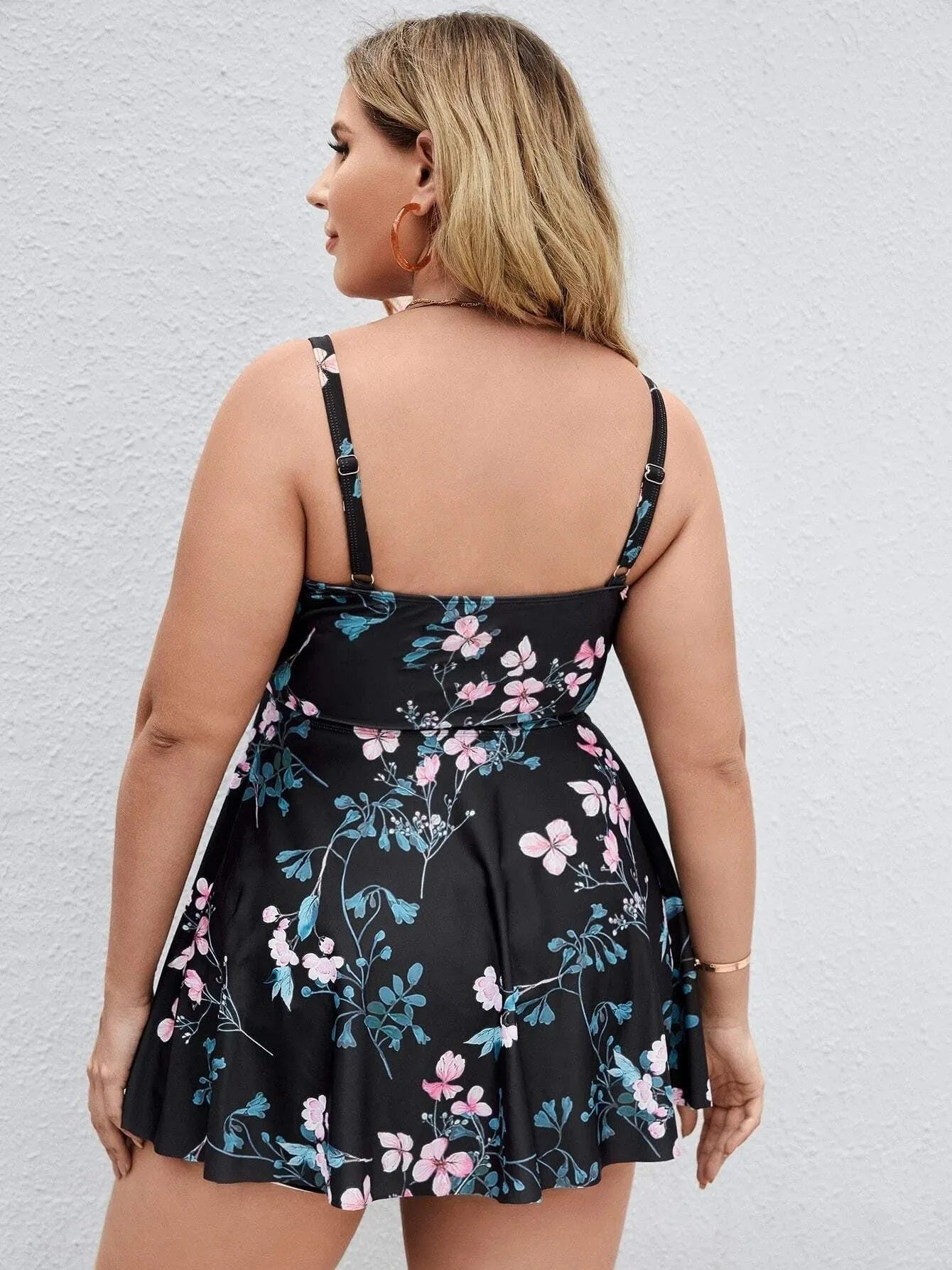 Women's floral print split colour one-piece swimsuit on a mannequin, showing front and back views.