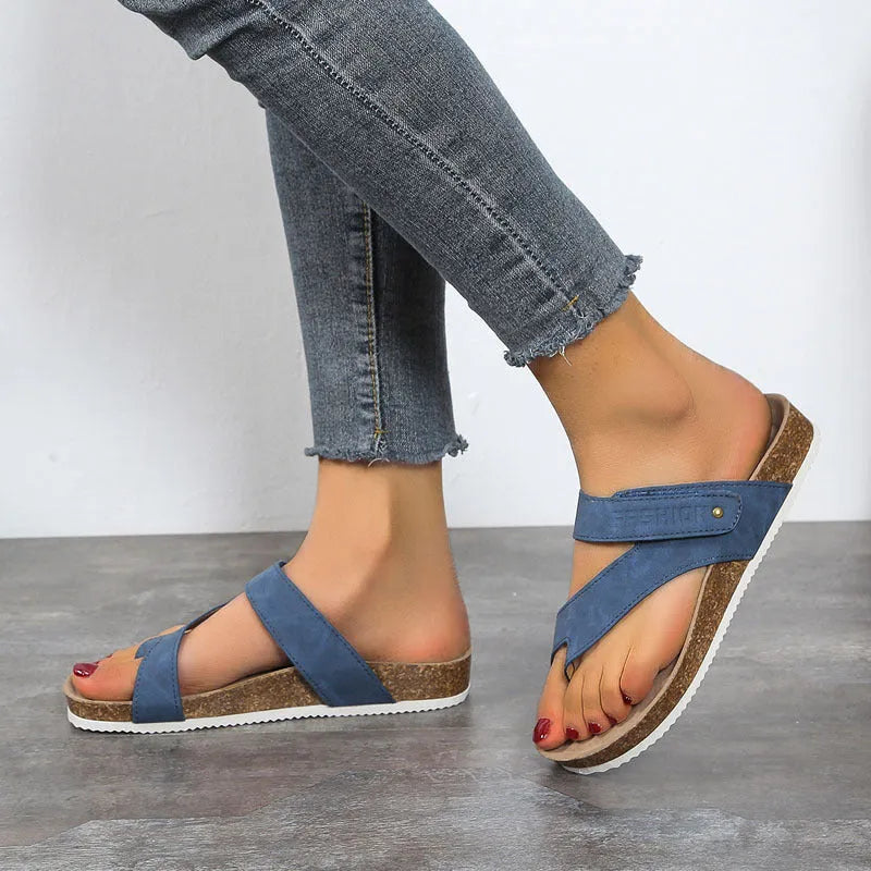 Flat toe ring thick-soled flip-flops in a solid colour on a white background.
