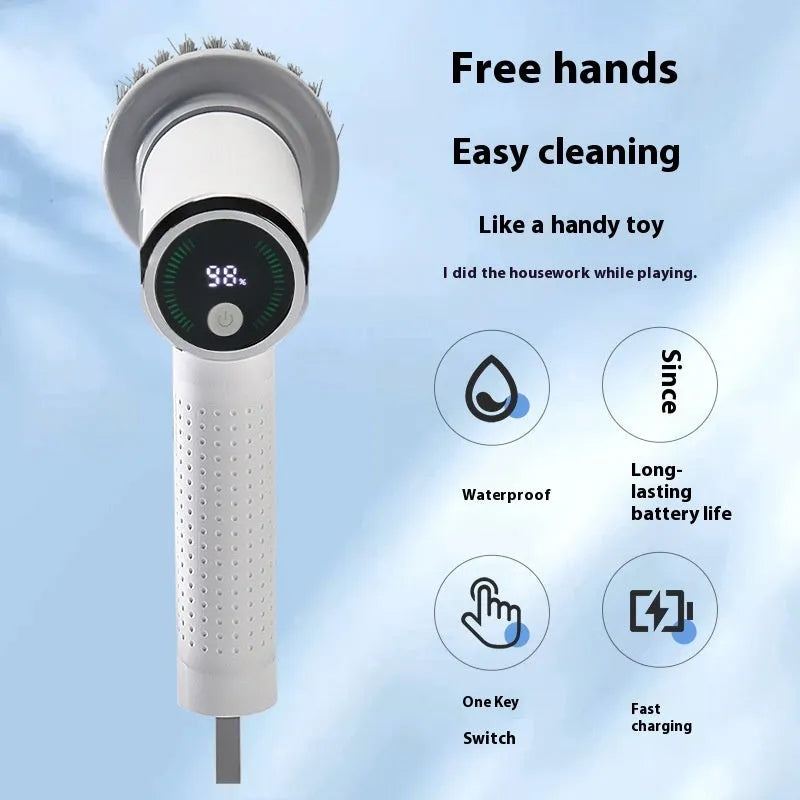White wireless electric cleaning brush with replaceable head on a kitchen counter