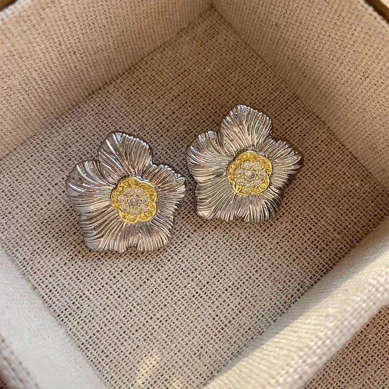 Retro copper stud earrings with textured gardenia floral design and two-tone electroplated finish