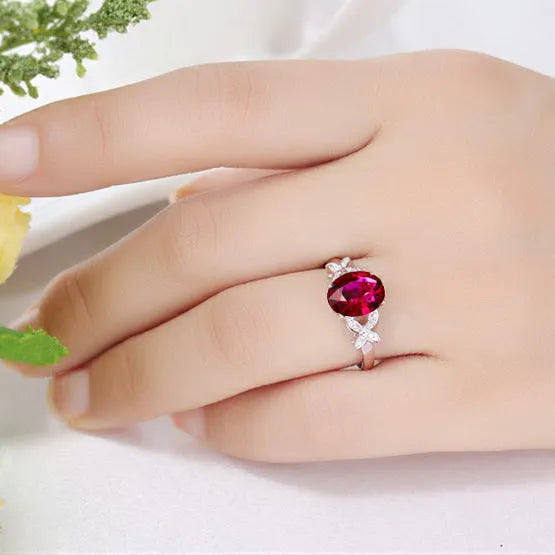 Women's copper butterfly ring with heart design in 18k rose gold tone, blue and red options