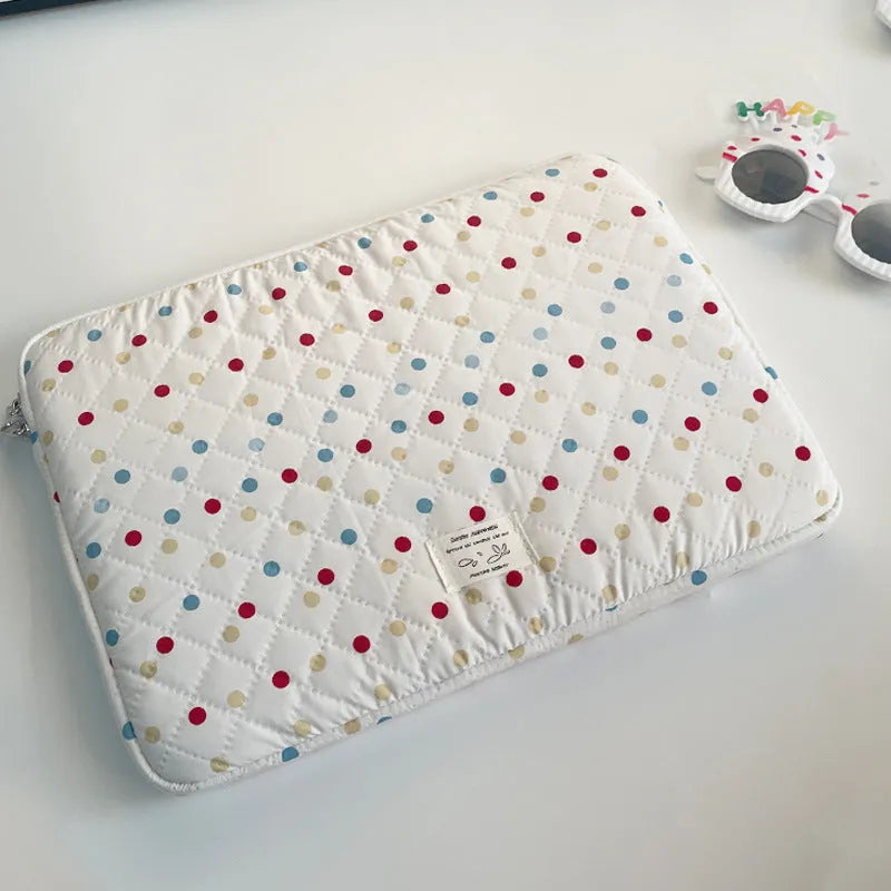 Polka dot patterned polyester laptop bag for women, shown in a solid colour with size options for 11, 13/14, and 15/15.6 inch laptops.