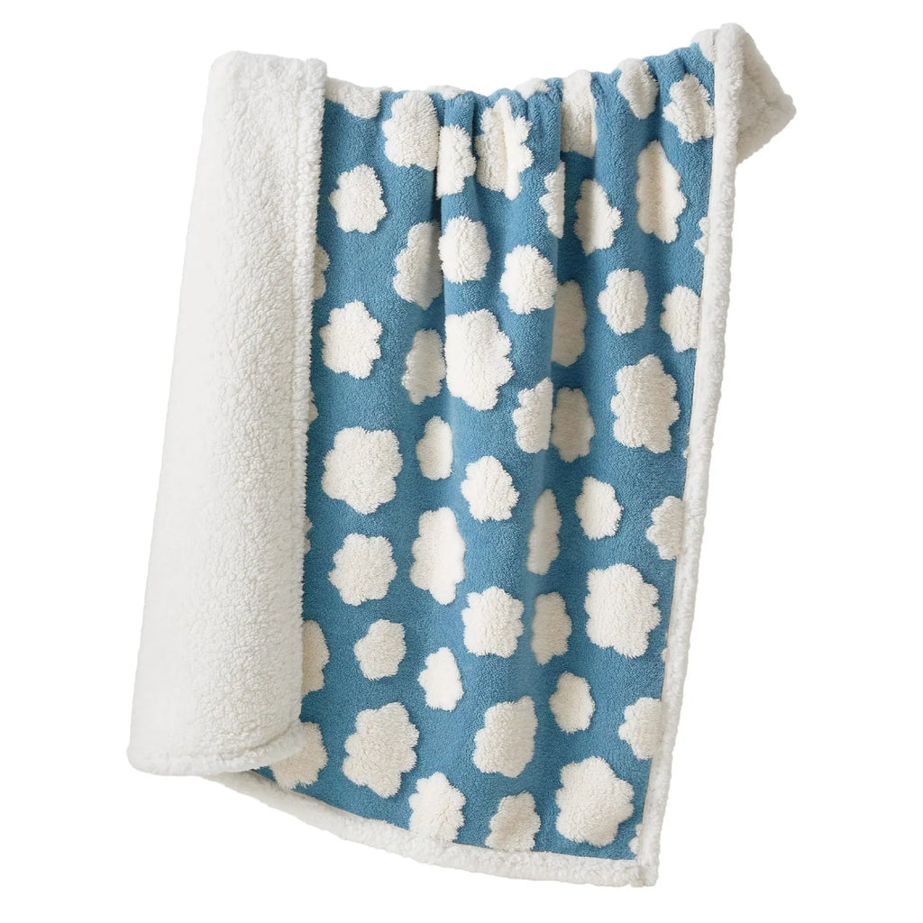 Waterproof dog blanket in blue sky white clouds pattern showing size options