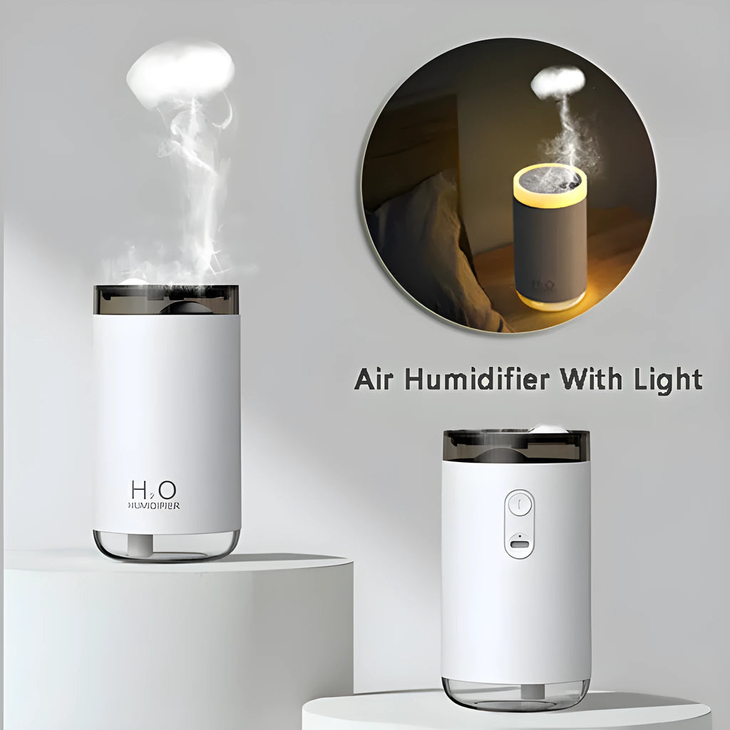 White portable USB humidifier emitting jellyfish-shaped smoke rings with a warm glowing night light on a desk