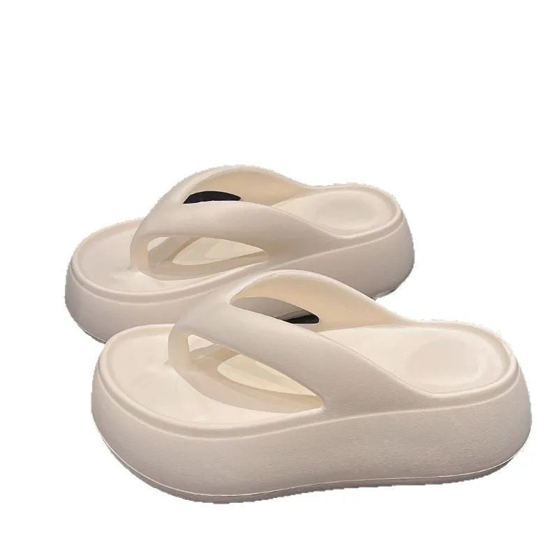 Women's thick-soled height increasing flip-flops in black with herringbone EVA upper