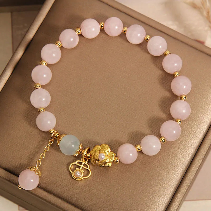 Women's pink crystal flower bracelet showing floral arrangement of stones on wrist