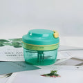 Green manual baby food processor with stainless steel blade and 300ml capacity