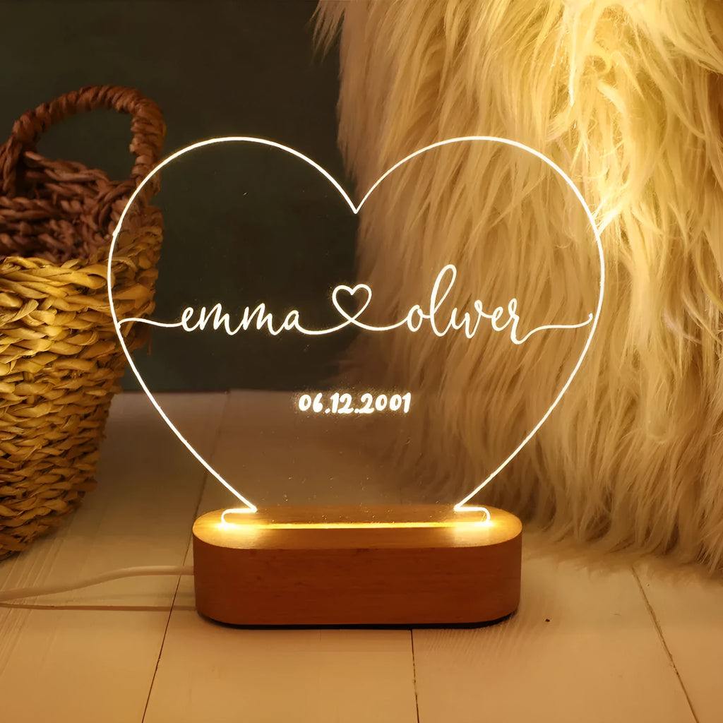 Personalised acrylic night light displaying custom names and date for Valentine's Day gift.