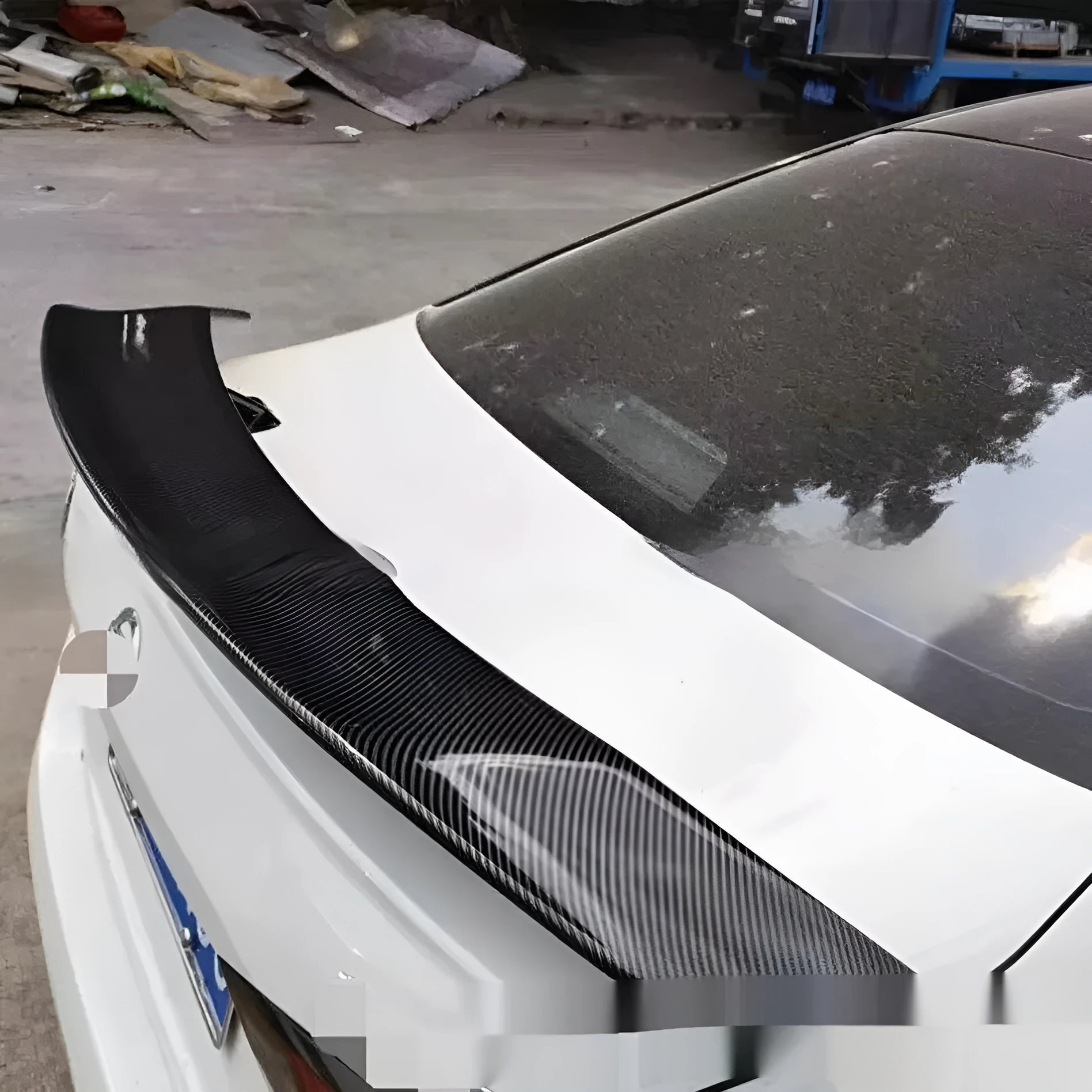 Universal punch-free ABS car spoiler in bright black, carbon, white, and blank finishes.
