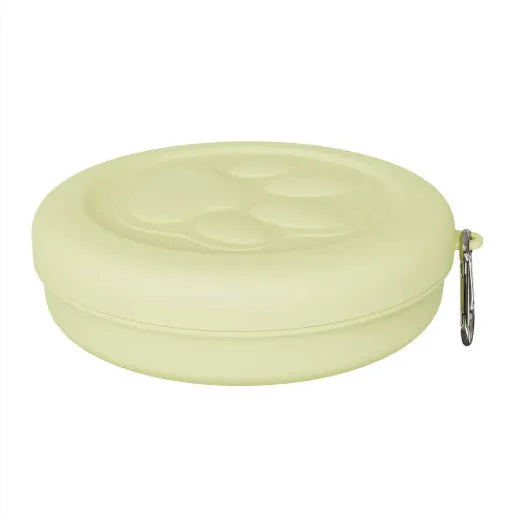 Portable outdoor dog food bowl with leash clip and a removable green silicone feeding mat.