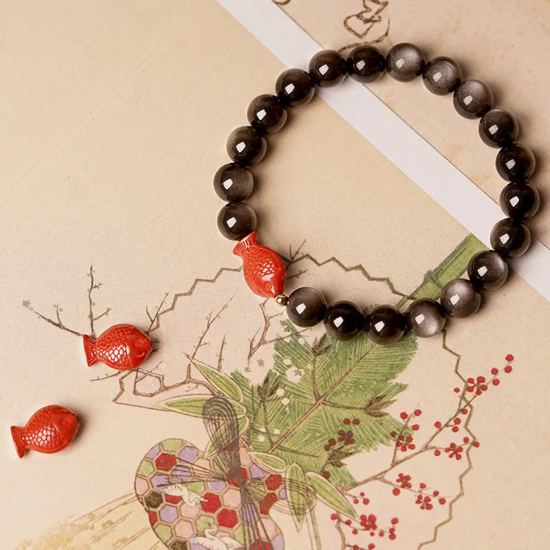 Natural obsidian bracelet with cinnabar fungal accents showing round beads in available sizes