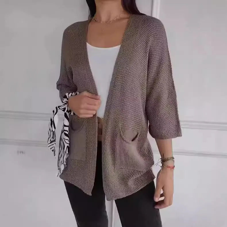 Women's waffle knit cardigan coat in apricot colour with nine-quarter sleeves and side pockets