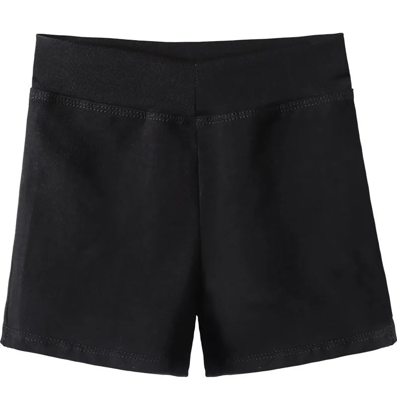 Black women's cotton dance practice shorts laid flat, showing solid colour and simple design.
