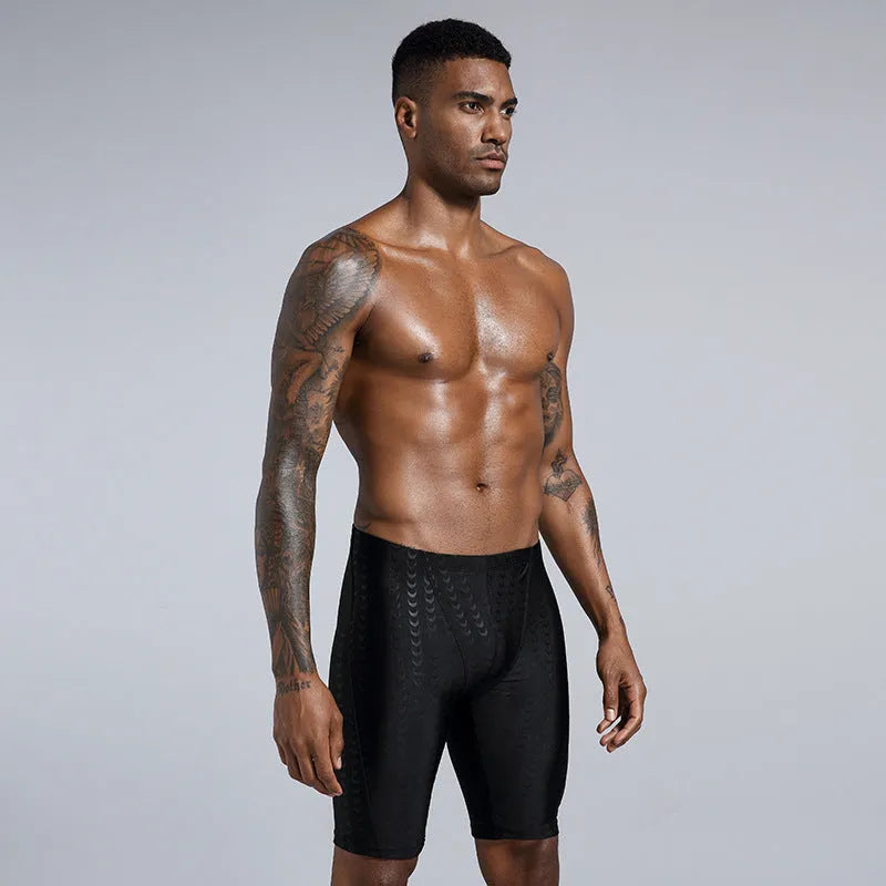 Men's solid colour swimming trunks in shark skin polyester fabric for beach surfing and swimming