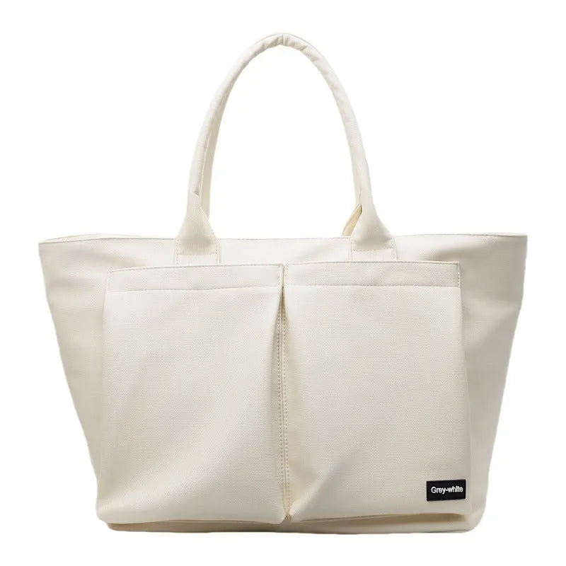 Lightweight PU shoulder bag in solid colour with adjustable 20-35L capacity for sport and travel