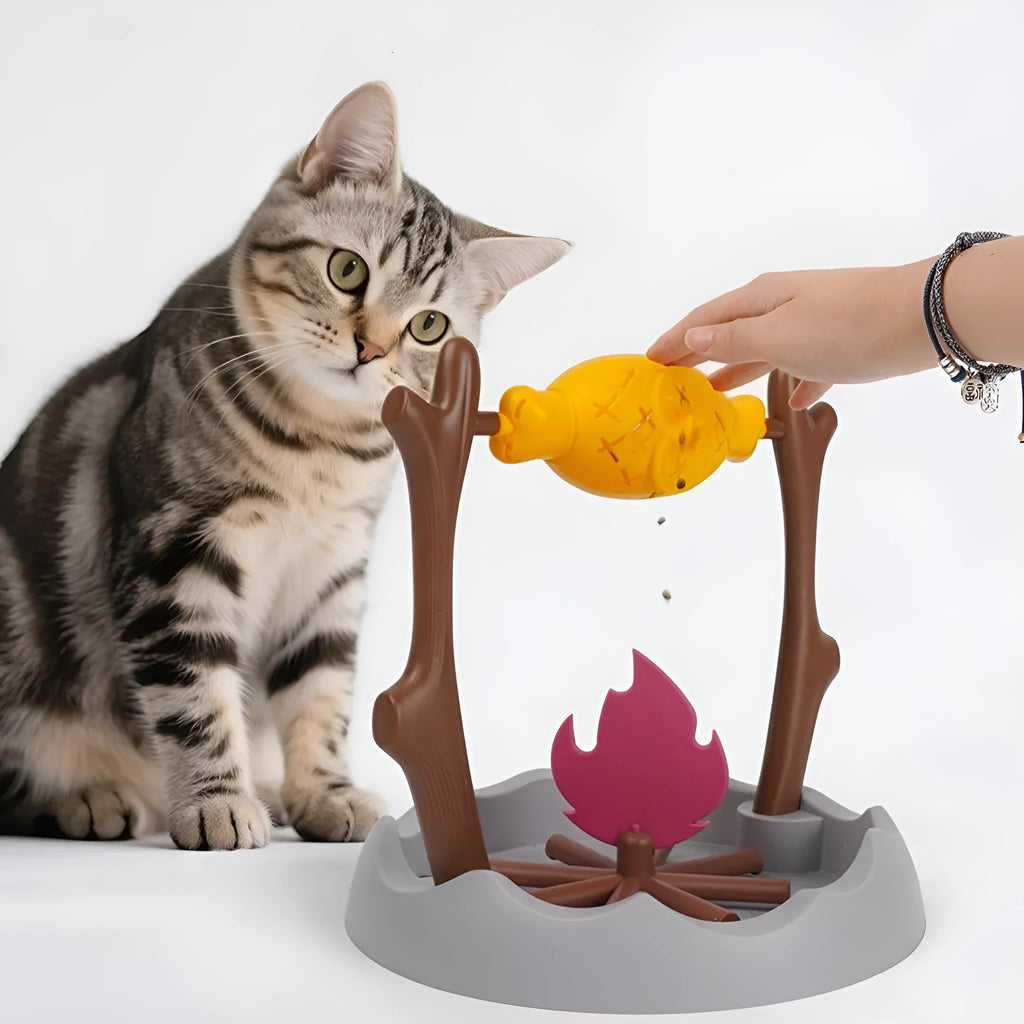 Barbecue-themed tumbling plastic cat food feeder toy for interactive play and slow feeding.