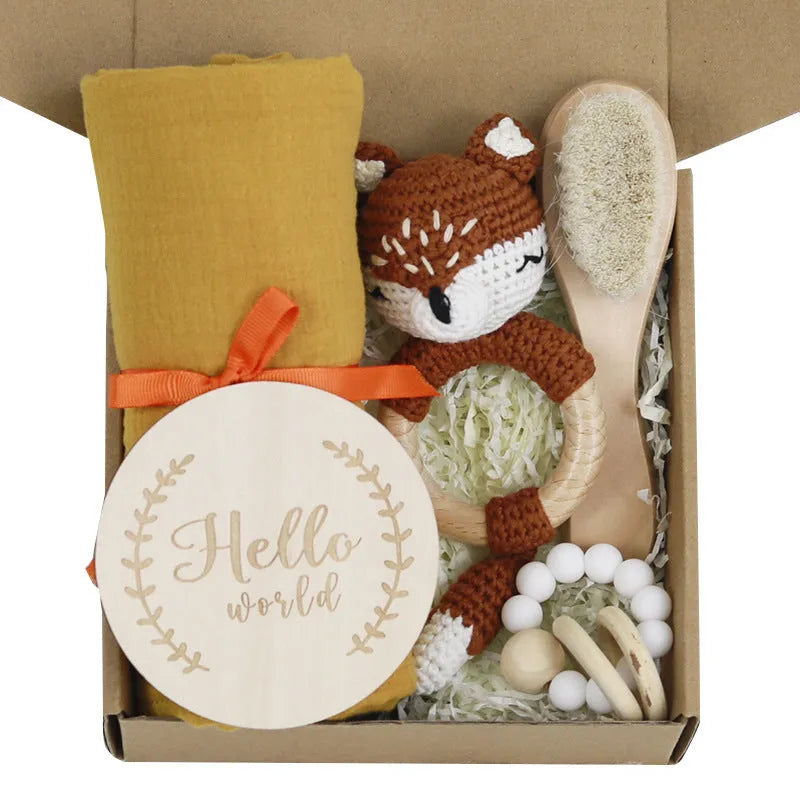 Baby teething gift set with wooden toys and large bamboo-cotton gauze blanket in assorted colours