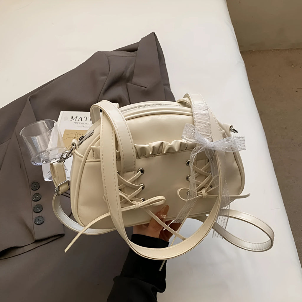 Women's casual PU leather shoulder handbag with a bandage bow detail, shown in beige colour.
