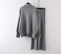 Women's beige acrylic fibre sweater and wide-leg trousers two-piece set on a hanger.