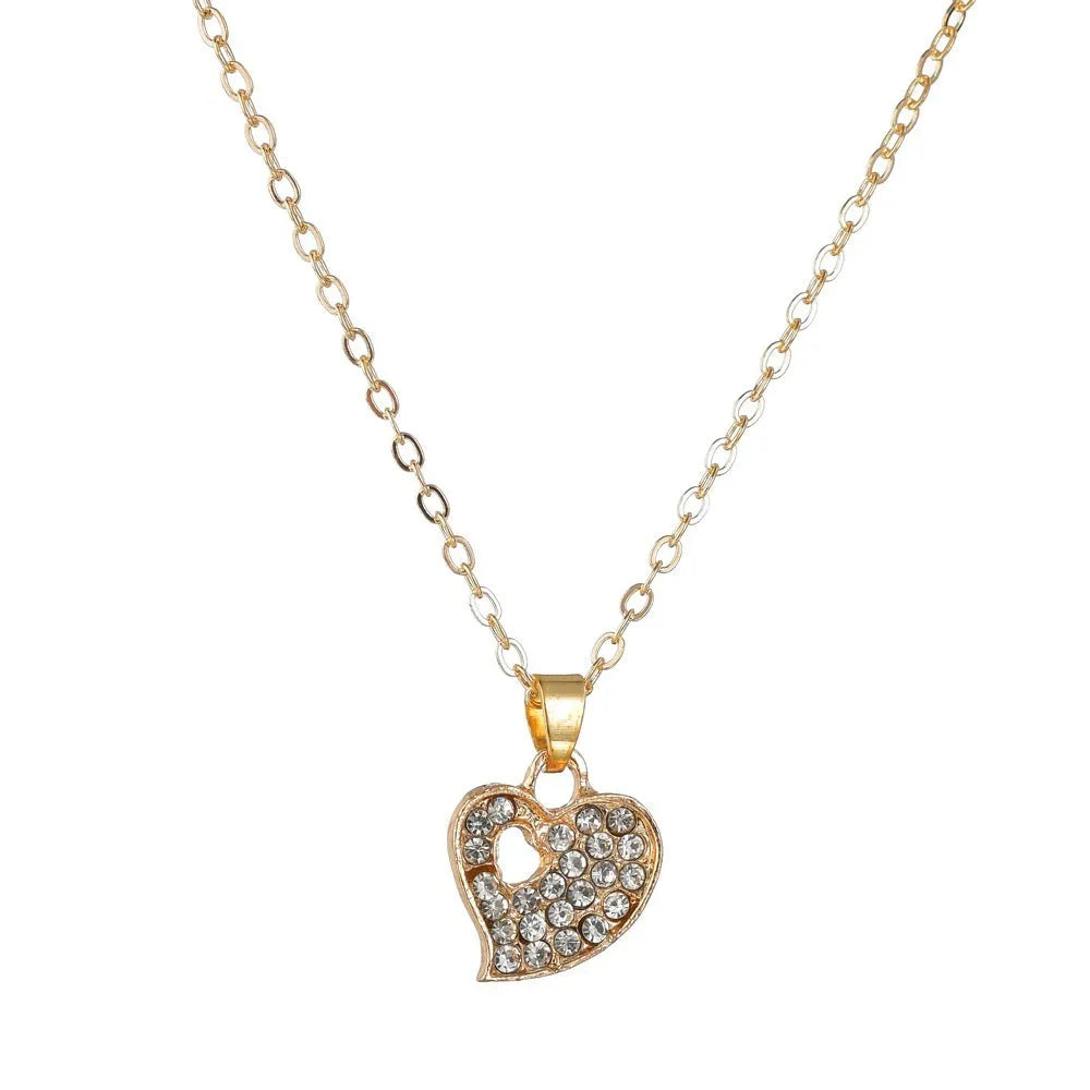 Gold tone alloy jewellery set with earrings, pendant and bracelet featuring love, water drop or bell patterns