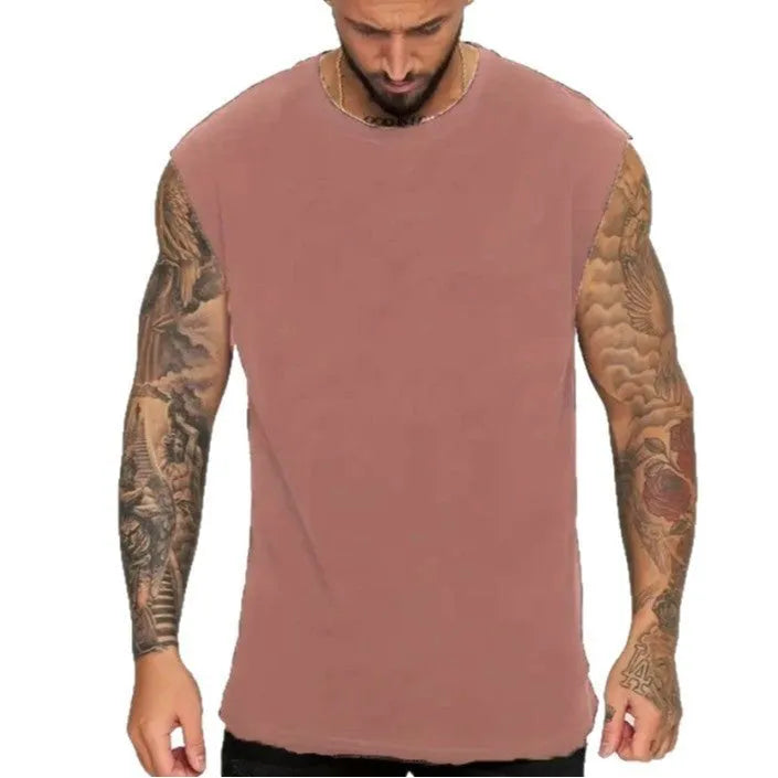 Man wearing a loose-fit solid colour cotton sleeveless tank top for summer.