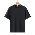 Modal solid colour loose fit short-sleeved T-shirt on hanger, showing apricot colour option.