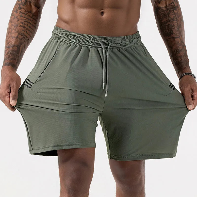 Man wearing black Ice Silk nylon sports shorts with a drawstring waist and cropped leg.