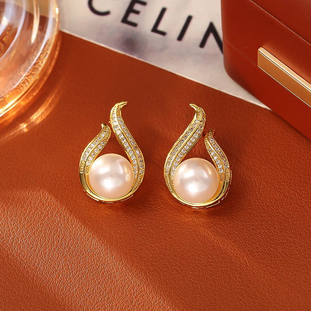 Glass pearl stud earrings with real gold plating on copper base, four colour options round geometric style