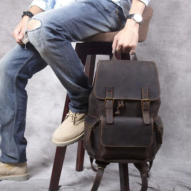 Retro crazy horse leather backpack in brown showing double shoulder straps and soft handle