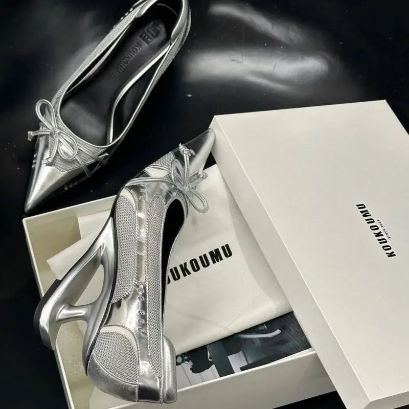 Women's black pointed toe Mary Jane shoes with floating heel design and slip-on closure