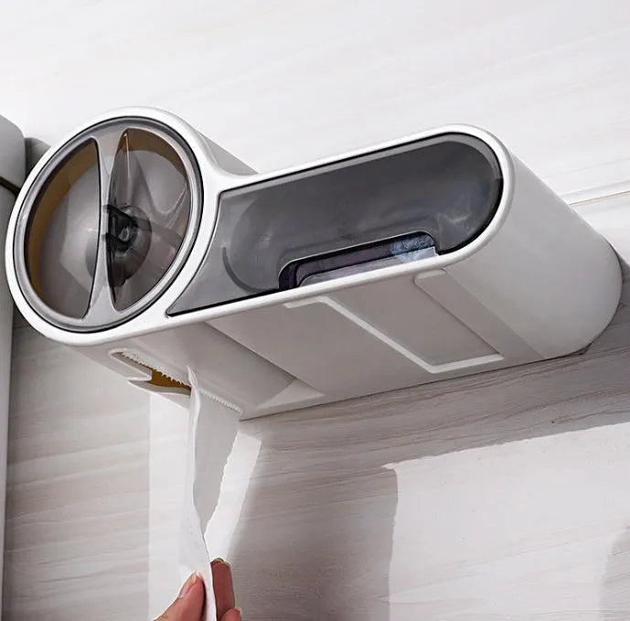 White plastic bathroom roll holder with a streamline curve design on a bathroom surface.