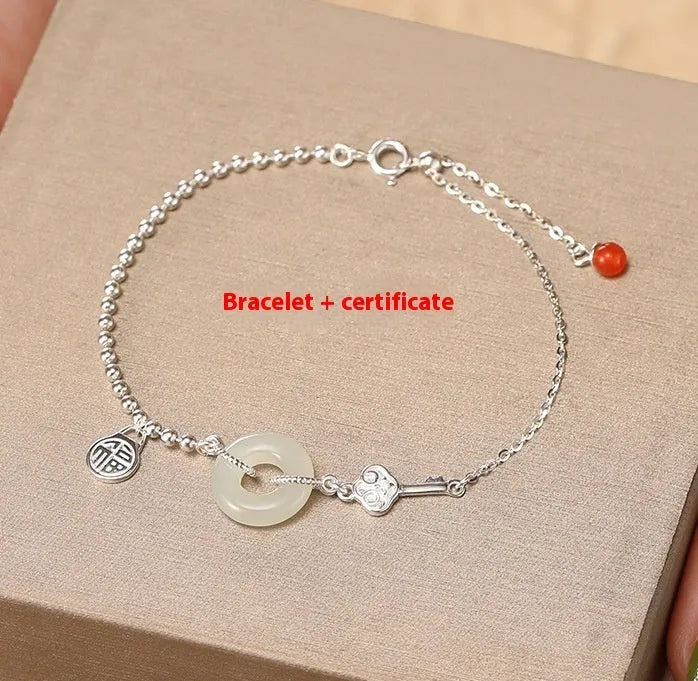 Silver Hetian jade bracelet with peace buckle charm and Chinese Ruyi Xiaofu design for women