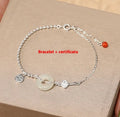 Silver Hetian jade bracelet with peace buckle charm and Chinese Ruyi Xiaofu design for women