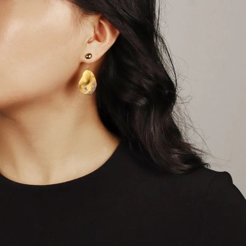 Asymmetric floral earrings with zircon stone centrepiece in gold or silver plating
