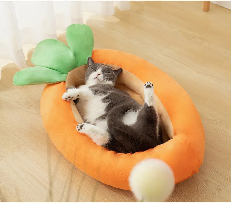 Carrot-shaped dog nesting bed with a soft, light-coloured blanket inside, suitable for a small dog.