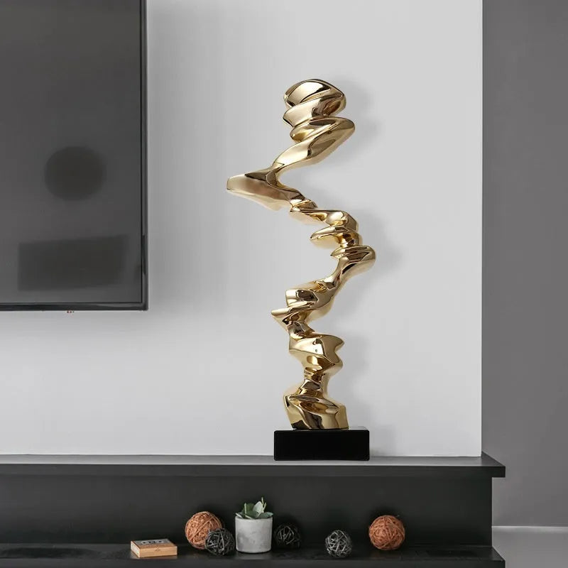 Abstract minimalist resin ornament in metallic colours for modern interior decoration