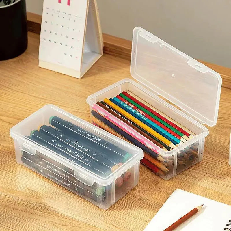 Transparent plastic pencil storage box showing interior space for organising stationery