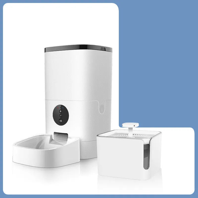 White smart pet automatic feeder with 6 litre capacity, stainless steel tray, and digital timer on a kitchen counter