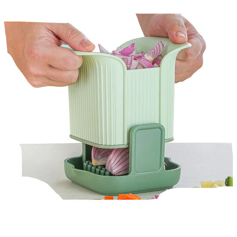 Green handheld multi-functional vegetable chopper with stainless steel blades for onions and potatoes