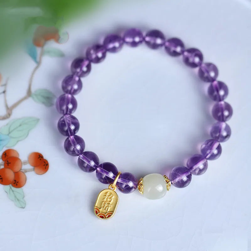 Close-up of a women's bracelet with purple amethyst crystal geometric beads measuring 8mm