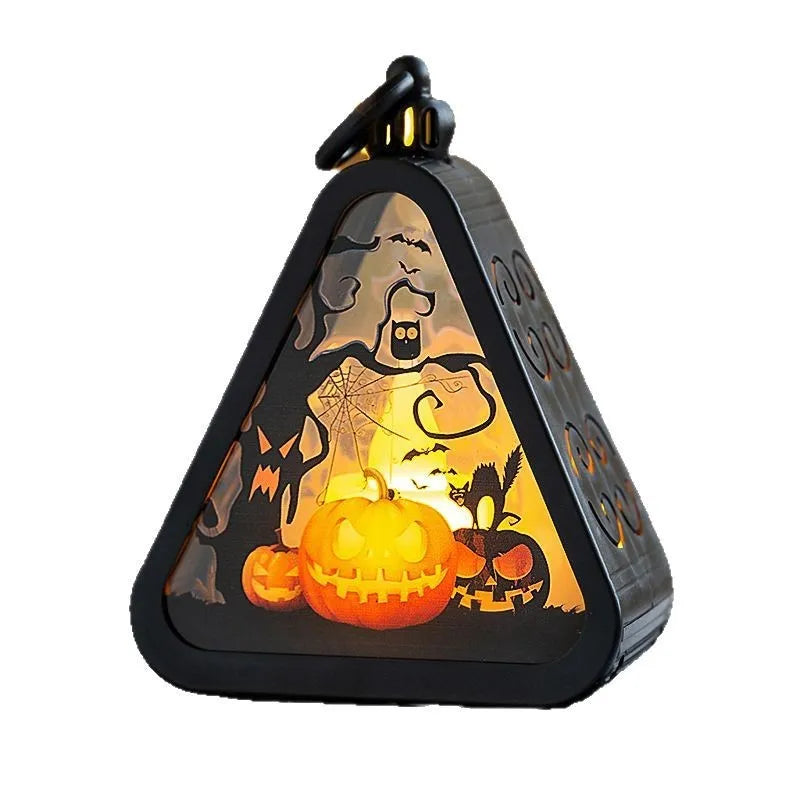 Compact portable Halloween pumpkin lamp decoration in plastic and glass.