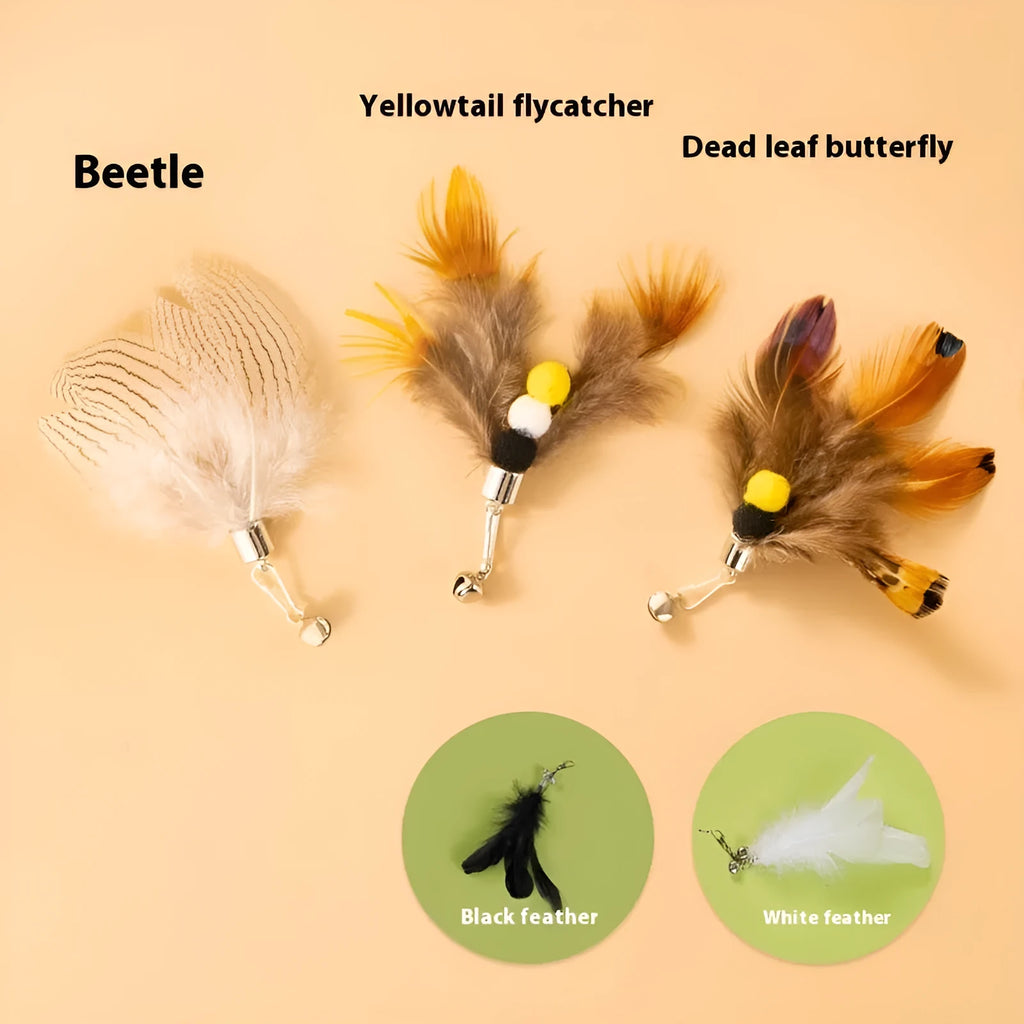 Three steel wire cat toys shaped like small flying insects on a plain background.