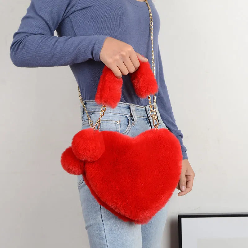 Women's soft plush heart-shaped handbag in medium size with adjustable shoulder strap