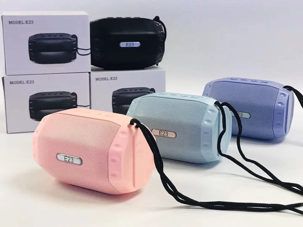 Compact USB Bluetooth wireless speaker in black, blue, pink, or purple colour options.