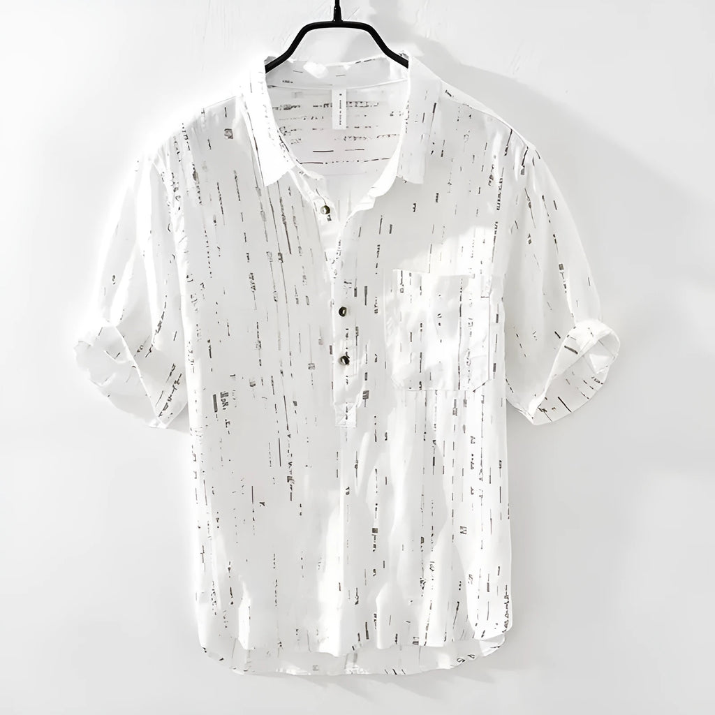 Man wearing a black loose-fit lapel polo shirt, short sleeves, casual summer style.