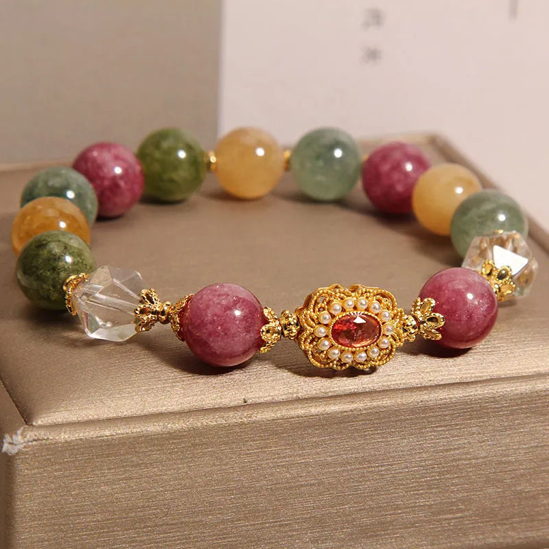 Close-up of a jade colour tourmaline bead bracelet on a pearl crystal base with alloy setting and rhinestones.