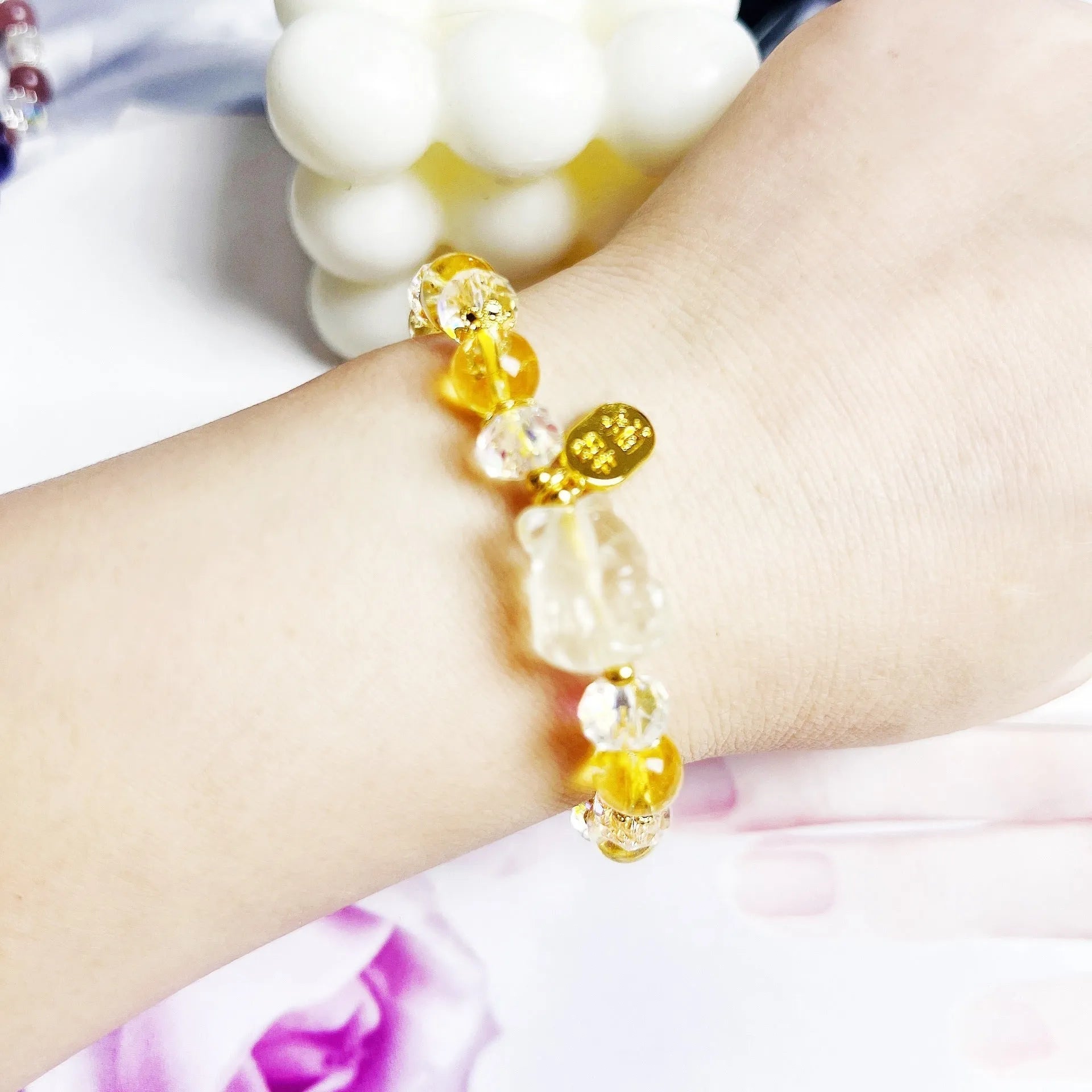 Handmade adjustable bracelet with a natural citrine nine-tail fox charm on a silver-tone chain.