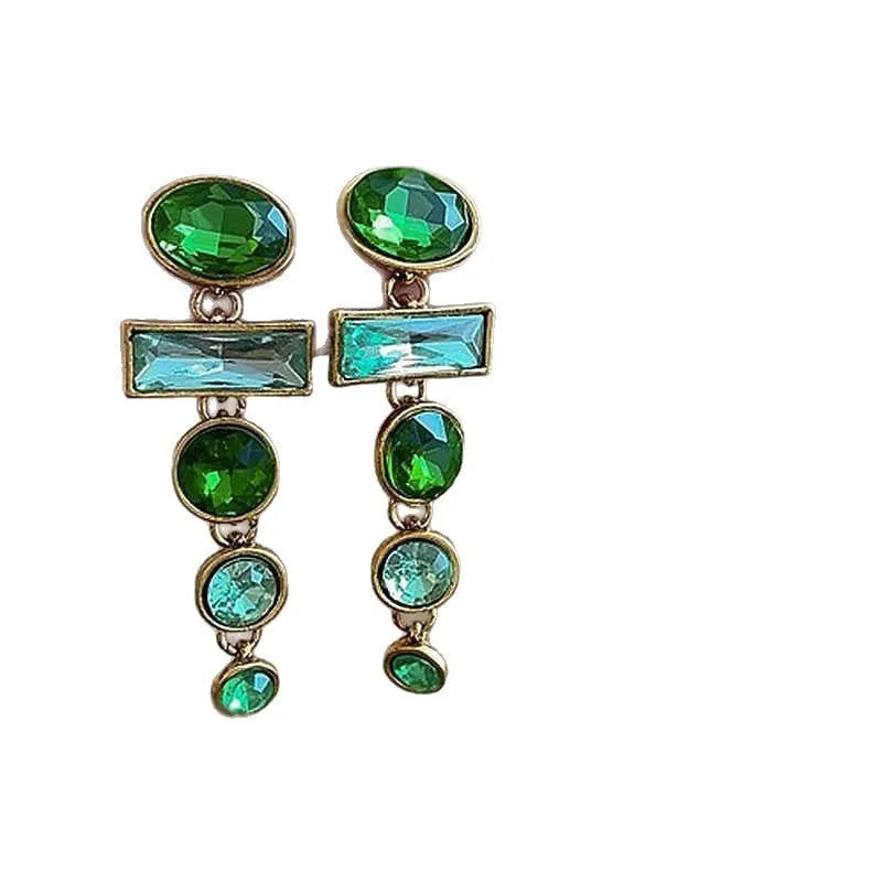 A pair of green gradient retro earrings with a geometric shape, tassel detail, and zircon inlay on an alloy base.